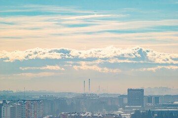 City from a height in smog on a winter day