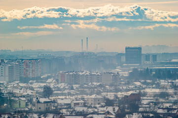 City from a height in smog on a winter day