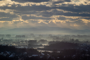 City from a height in smog on a winter day