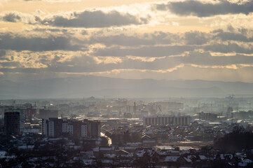 City from a height in smog on a winter day