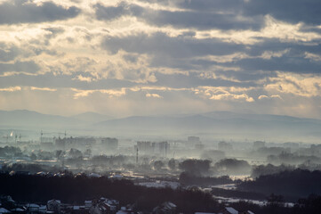 Fototapeta premium City from a height in smog on a winter day