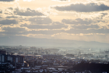 City from a height in smog on a winter day