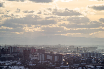 City from a height in smog on a winter day