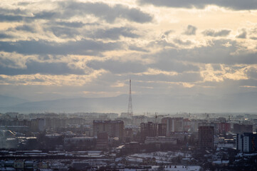 Naklejka premium City from a height in smog on a winter day