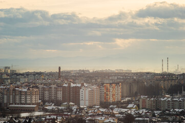 City from a height in smog on a winter day
