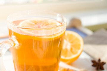 Autumn hot tea with lemon and spices