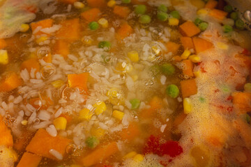 colorful vegetables cooking soup boiling water
