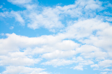 White clouds with blue sky background copy space. Sunshine day with beautiful clouds.