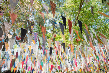 Colorful cloth bunting decoration in outdoor summer festival party. Vintage retro festival and celebration concept.