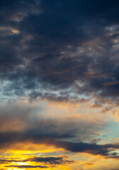 Rain clouds in the sky at sunset