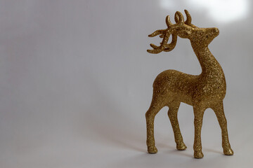 A golden deer toy. Christmas Golden Deer
