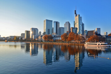 Fototapeta na wymiar View on Frankfurts Skyline in autumn with a reflection of the buildings in the river, Frankfurt, Germany