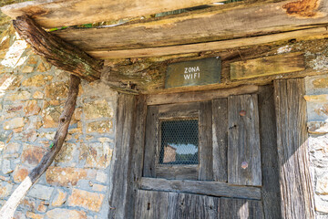 Antique wooden door with text indicating wifi zone