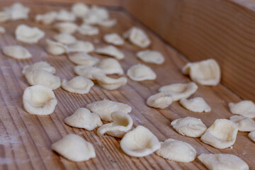 orecchiette. dumplings on a wooden table
