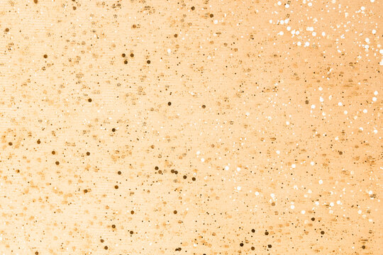 Shiny golden brown background with bright rhinestones