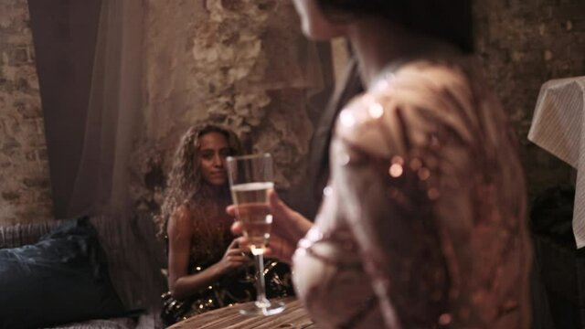 Young Fashion Models Holding Champagne