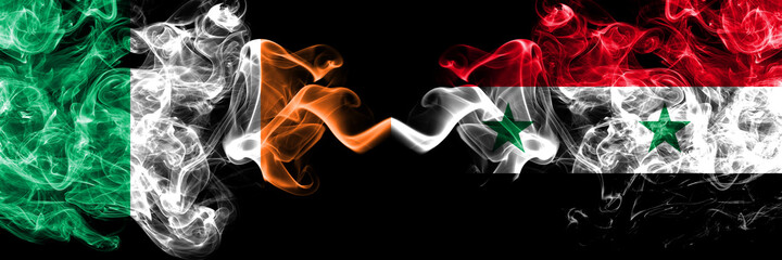 Republic of Ireland, Irish vs Syria, Syrian smoky mystic flags placed side by side. Thick colored silky abstract smoke flags.