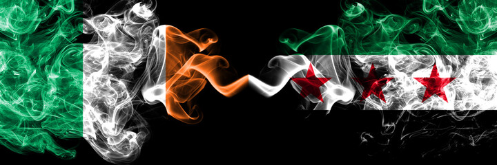 Republic of Ireland, Irish vs Syria, Syrian Arab Republic, three stars smoky mystic flags placed side by side. Thick colored silky abstract smoke flags.