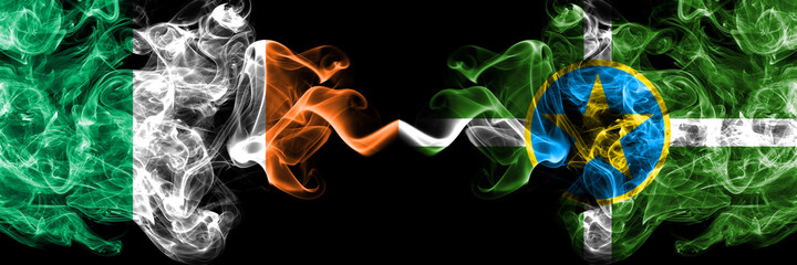 Republic of Ireland, Irish vs United States of America, America, US, USA, American, Jackson, Mississippi smoky mystic flags placed side by side. Thick colored silky abstract smoke flags.
