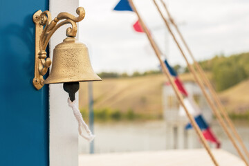 close-up of a bell on a ship of gold color