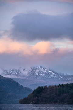 Majestic landscape image across Loch Lomond looking towards snow capped Ben Lui mountain peak in Scottish Highlands © veneratio