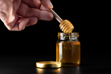 Honey jar with wooden dipper