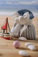 sweet food and a boat at  the seaside.
still life with sweet almonds and a boat at the seaside. italian food to celebrate wedding and newborn. - 408035299