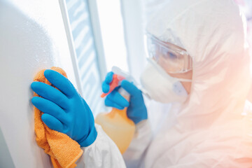 Medical specialist in hazmat suits cleaning disinfection sanitize coronavirus virus pandemic health risk