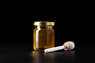 Honey jar with wooden dipper