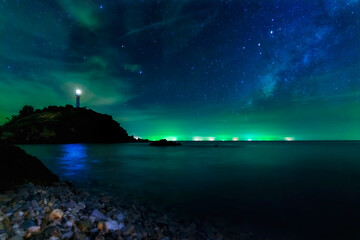 Long exposure photos. Lighthouse Star and the Milky Way at Lanta Island, Krabi Province, Thailand.