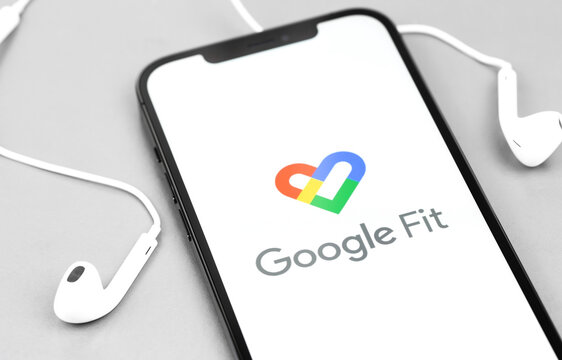 Google Fit App On The Screen Smartphone With Headphones. Google Fit Is A Health Tracking Platform Developed By Google. Moscow, Russia - December 5, 2020