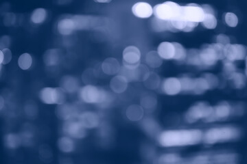 blurred bokeh city background / glare and glowing light in night city, modern beautiful bright background