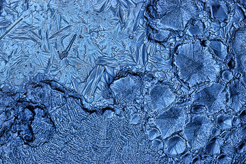 blue ice glass background, abstract texture of the surface of the ice on the glass, frozen seasonal water
