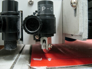 Cutting knife and creasing wheel for cardboard packaging samples. Plotter.