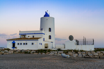 typical white Andalusian buildings in La Duquesa at sunset