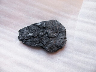 A sample of a layered rock of the native mineral graphite.