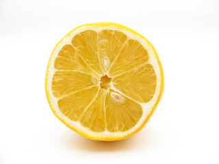 Sliced yellow fresh lemon on a white background. Half of it.