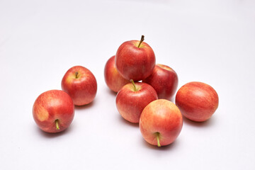 red mini apples on white background