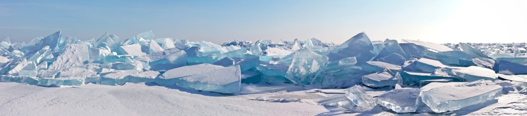 A panorama of the edge of a hummock field with beautiful huge blocks of transparent blue ice on the...