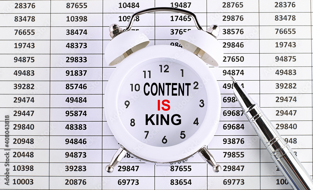 Poster business concept. text content is king on alarm clock on chart background