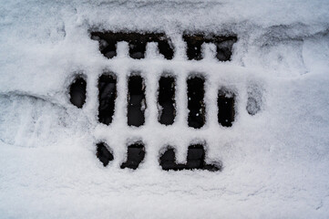 A closeup shot of a snow-covered gutter