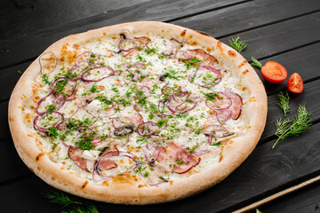 Fresh tasty pizza on black wooden background