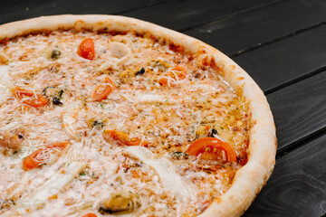 Tasty fresh cheese pizza on wooden background