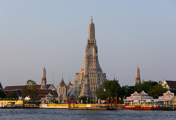 View of Wat Arun Temple from the Chao Phraya river. Buddhist temple in Bangkok, Thailand 