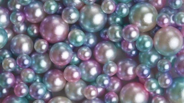 Mother-of-pearl multicolored as a background wrinkles in a circle. Seafood gems.