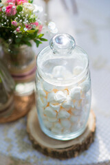 Obraz na płótnie Canvas Small marshmallows in a glass jar close-up