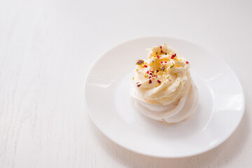 Obraz na płótnie Canvas meringue cake. Pavlova dessert on a white background