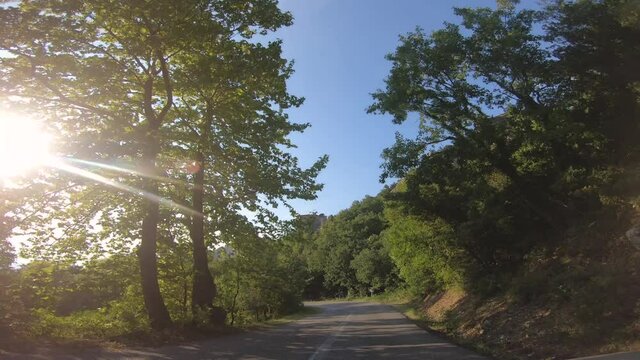 Camera car front pov driving on panoramic road by Meteora rock mountains near Kalambaka, Greece