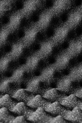 Fototapeta na wymiar Abstract texture of black acoustic foam.