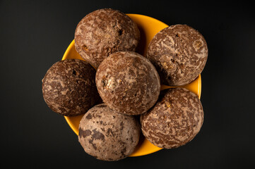 Brown cookies on a plate. Homemade cookies cooking concept. This idea on a black background